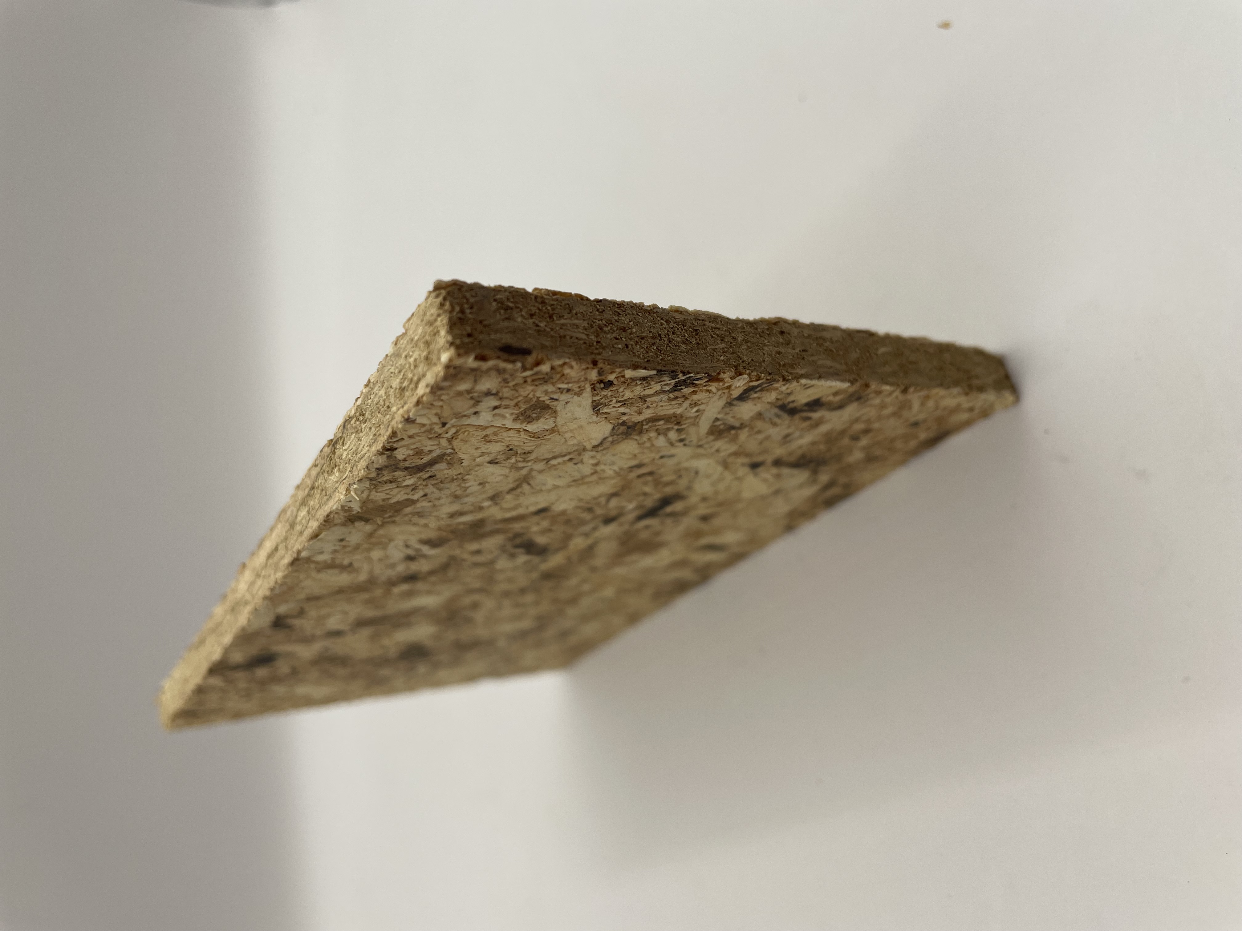 Ábhar bio-composite panel surface contrasted against ash timber
